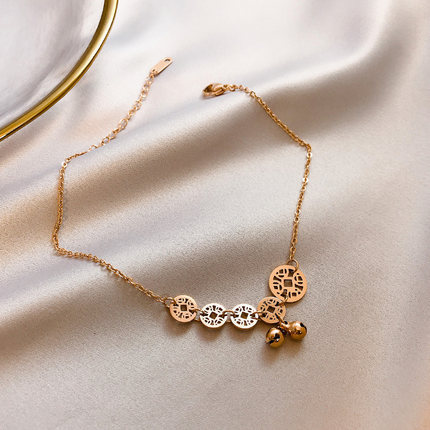 Lắc chân thép titan vàng 18K hình chuông may mắn