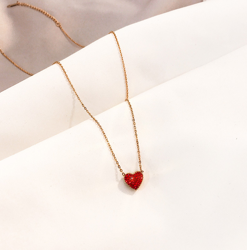 Dây chuyền làm từ thép titan mặt mạ vàng 18k hình trái tim đính đá hai mặt