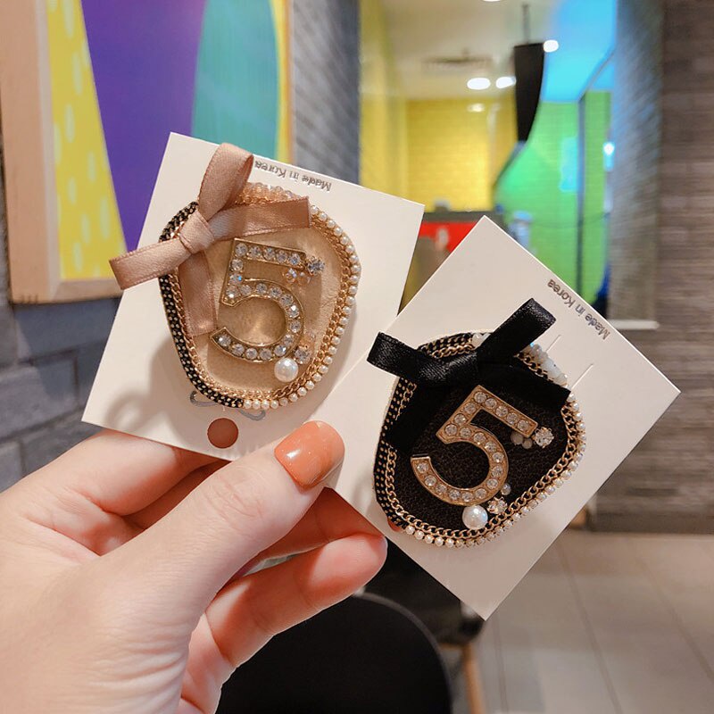 Ghim cài áo hình nơ đính ngọc trai giả sang trọng