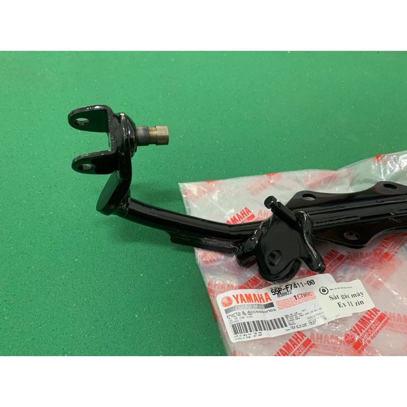 Sắt gác chân máy Ex 135 xe 5 số 2011 - 2014 zin