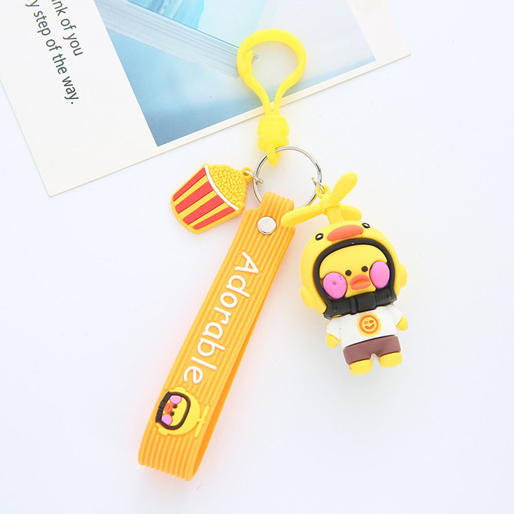 Móc khóa hình vịt con đội nón bảo hiểm xinh xắn