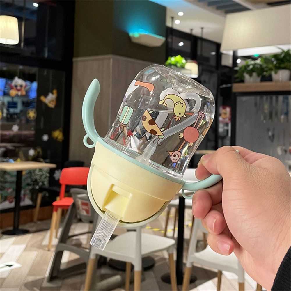 Bình uống nước 280ml có tay cầm và ống hút chống tràn họa tiết hoạt hình cho bé