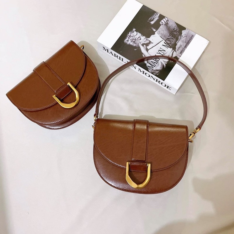 Túi Yên Ngựa CNK Nâu Socola Mới Nhất Gabine Saddle Bag