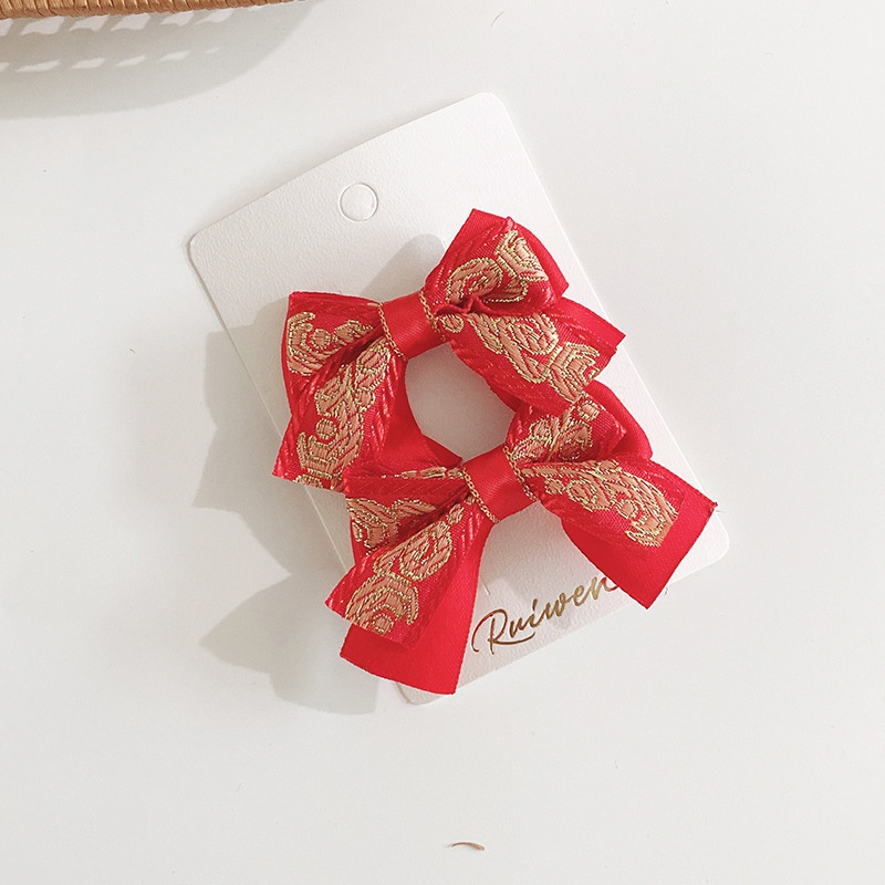 Bộ 2 kẹp tóc màu đỏ xinh xắn nhiều kiểu dáng làm quà tặng mừng năm mới cho bé gái