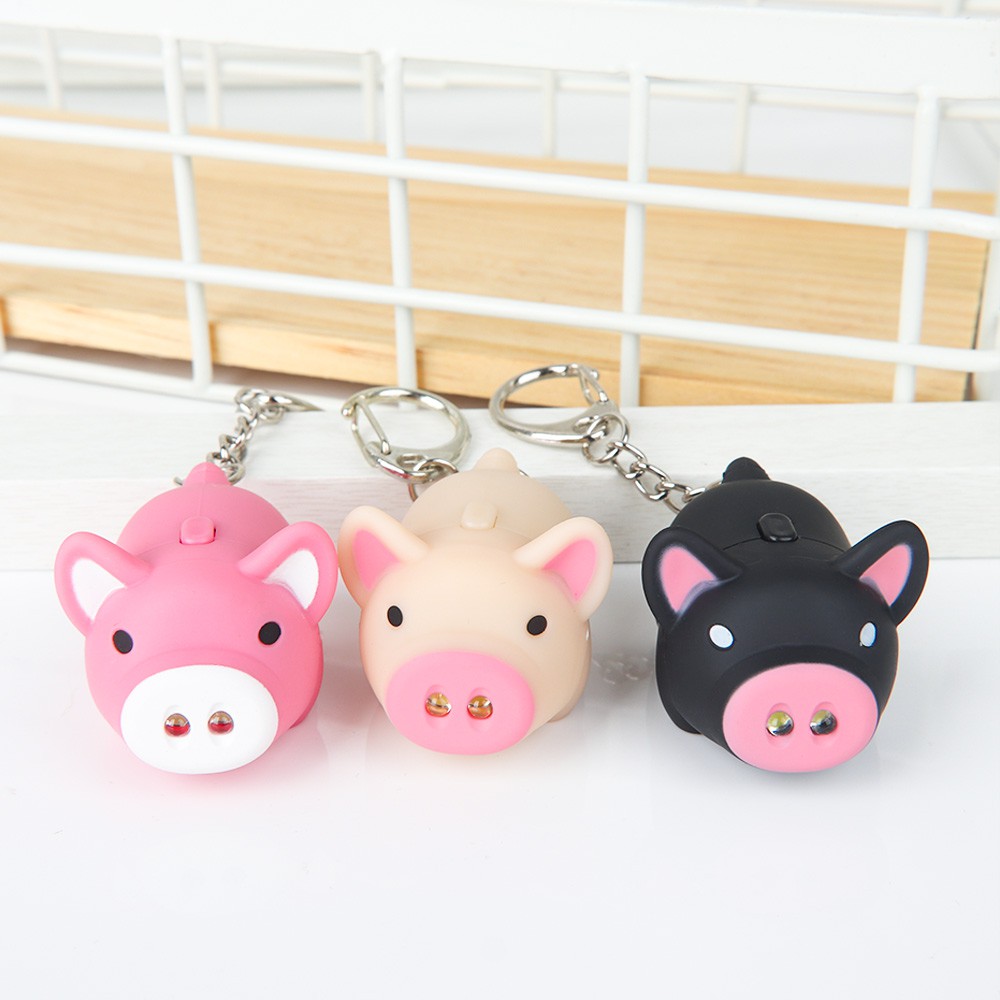 Móc khóa hình con heo có đèn led ngộ nghĩnh dễ thương