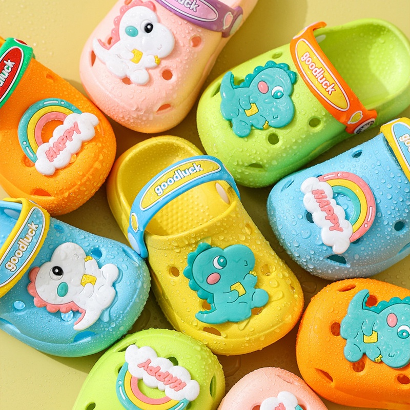 SANITKUN Giày bít mũi khoét lỗ mang trong nhà chống trượt họa tiết khủng long hoạt hình dễ thương dành cho trẻ em