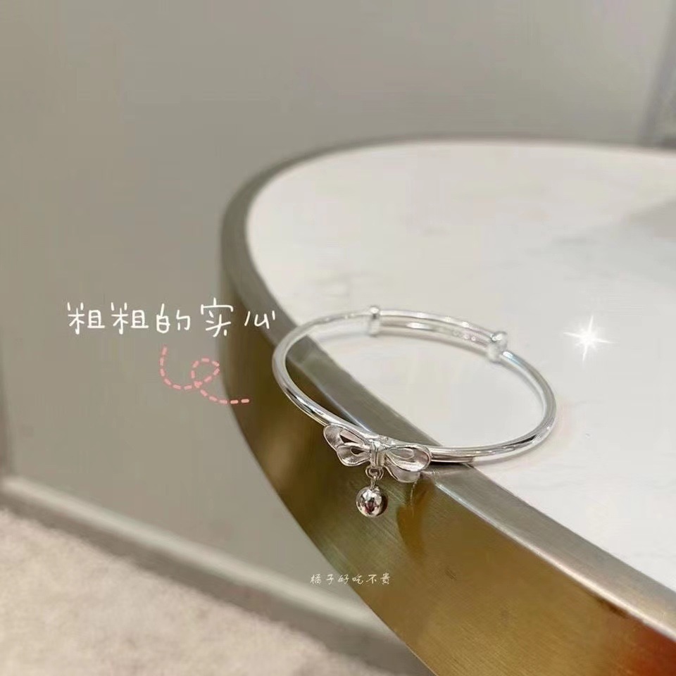 Lắc tay nữ nơ treo bi tròn thời trang nữ vòng tay thép không gỉ