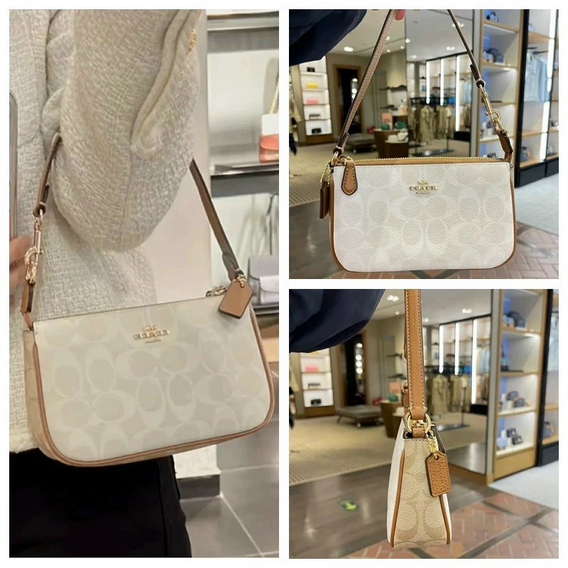 Túi kẹp nách nữ Coach thuyền full box 19cm x5cmx12cm màu trắng