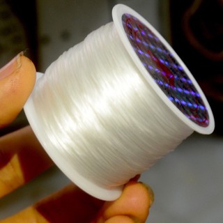 cuộn dây chỉ tơ xỏ chuỗi