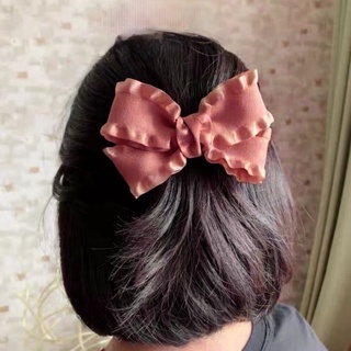 Cột tóc nơ hồng