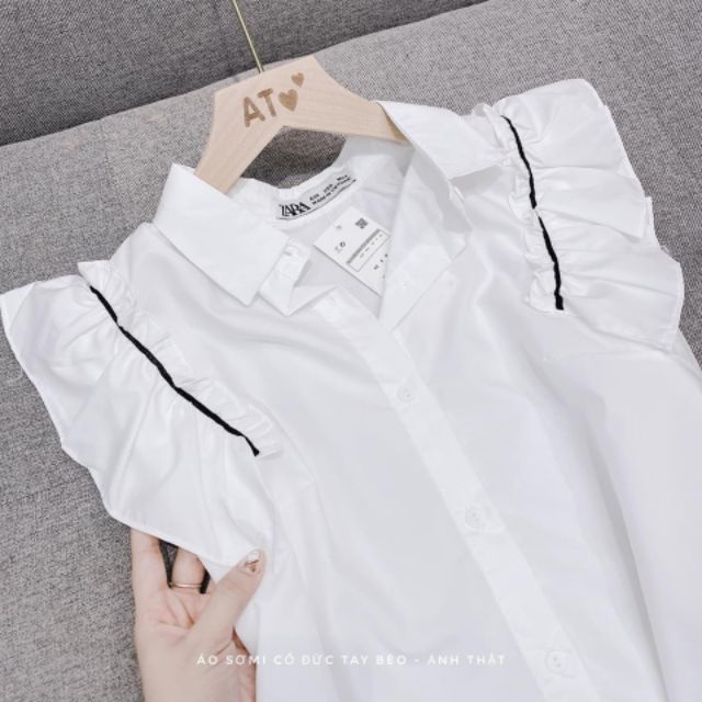 Sơ mi trắng cánh tiên chạy viền đen