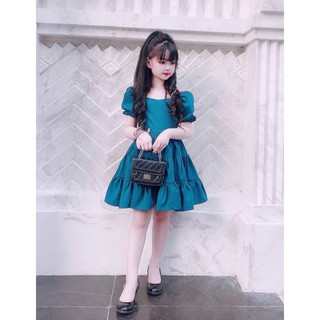 Váy xanh tầng nơ lưng cho bé