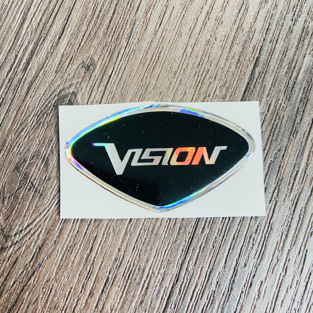 (TEM VISION) TEM LOGO VISION, tem phủ nhựa trong chữ VISION 2 màu lựa chọn