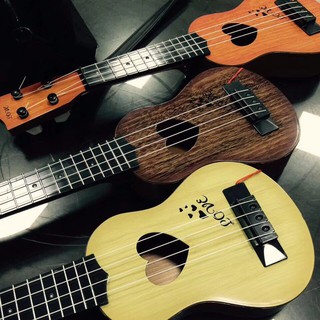 Bộ đồ chơi đàn guitar 4 dây cho bé  ( màu nâu gỗ)