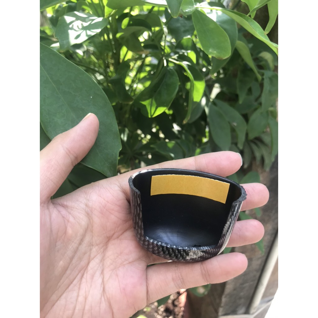 Ốp /chụp đèn soi biển số xe Exciter 150 màu Cacbon.