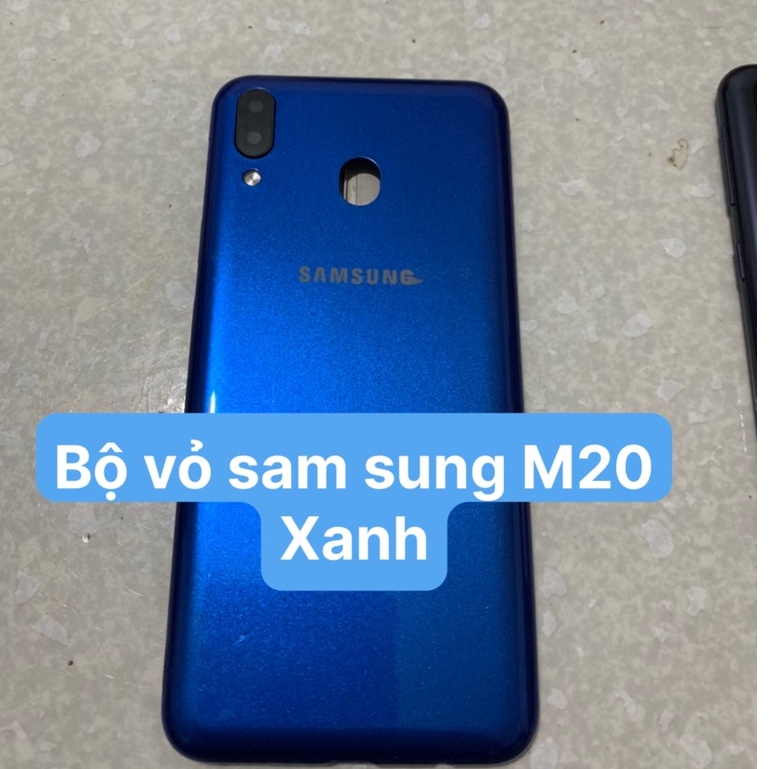 Bộ vỏ sam sung M20/M205S ZIN(GỒM :SƯỜN,LƯNG,SƯỜN,PHÍM BẤM ,KÍNH CAM)