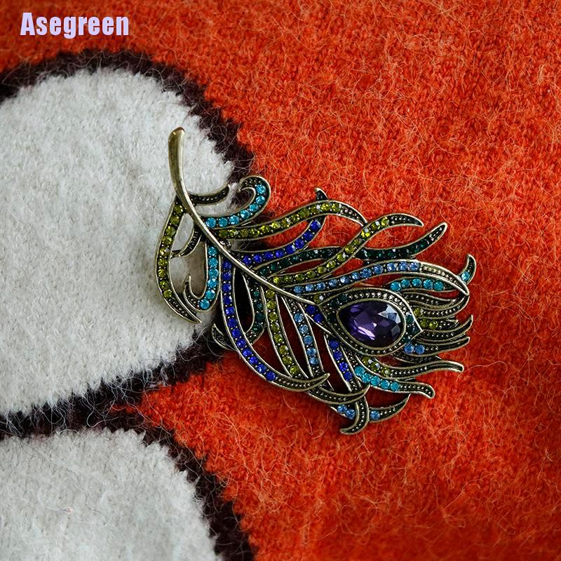 Ghim cài áo hình lông công đính đá pha lê sang trọng
