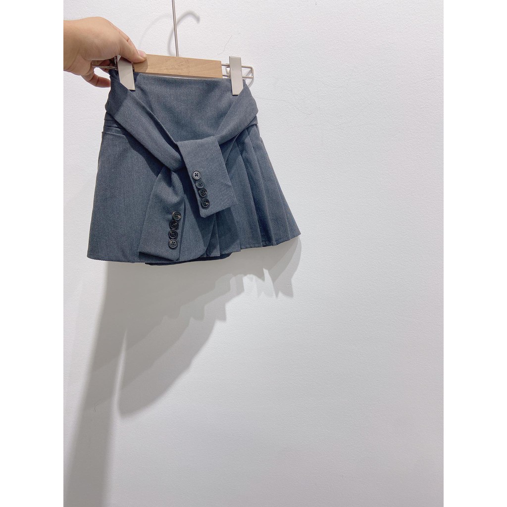 Chân váy cavat đính cúc bé gái