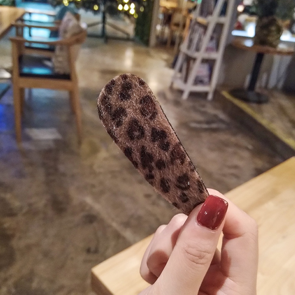 Kẹp tóc hình lông vũ thời trang