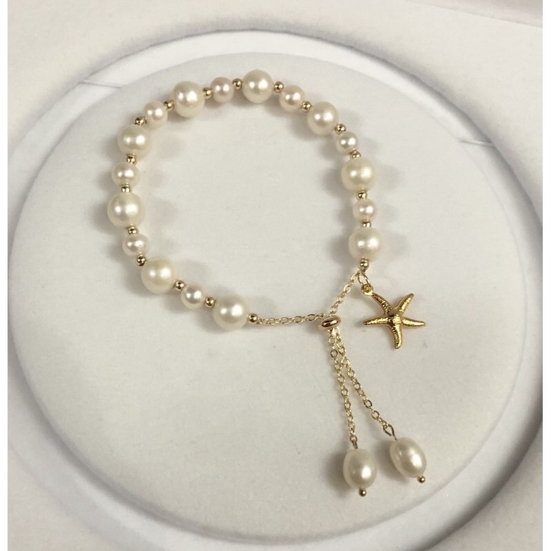Vòng tay hạt ngọc trai nhân tạo 8ly mix charm sao biển