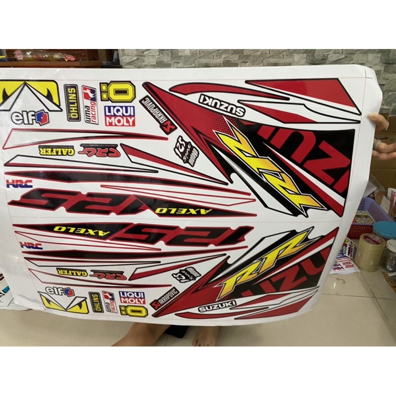 ( Quí khách vui lòng mang ra tiệm cho thợ dán ) Tem Axelo đỏ đen