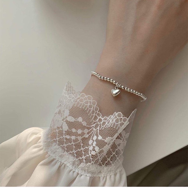 Vòng tay dây cước charm mạ bạc ngọc trai nhân tạo