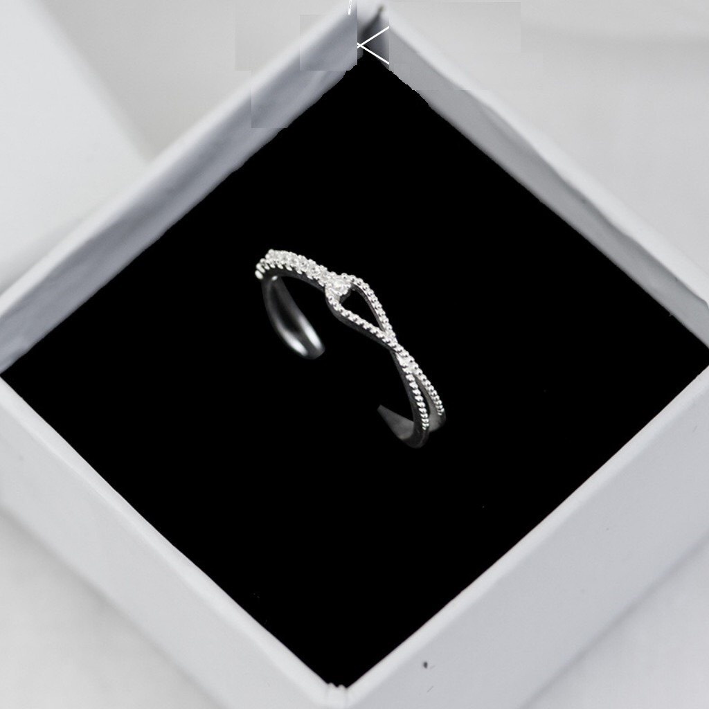 Nhẫn nữ vô cực đính đá nhỏ dáng hở chuẩn bạc ta - Kho sỉ bạc Nhất Linh