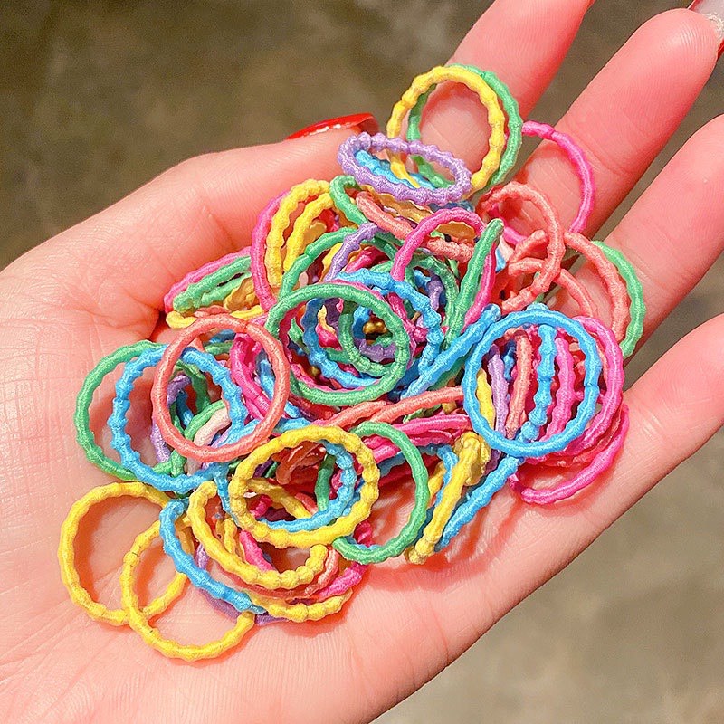 Hộp 100 chiếc chun buộc tóc nhiều màu sắc đáng yêu cho bé