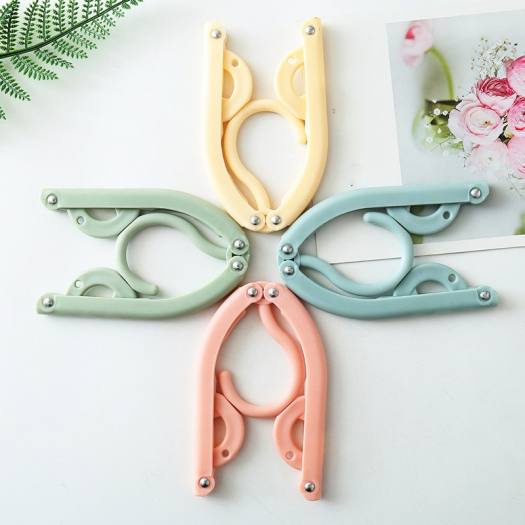 Móc nhựa treo quần áo gấp gọn thông minh Store4girls