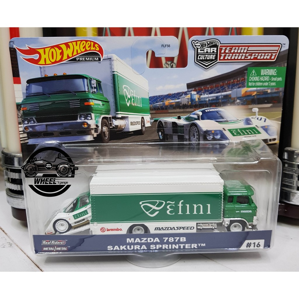 Xe mô hình đồ chơi bánh cao su Hotwheels 1:64 PREMIUM - TEAM TRANSPORT - Mazda 787B Sakura Sprinter 