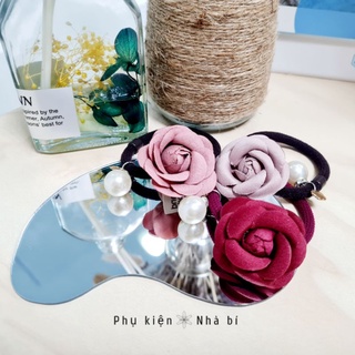 Cột tóc hoa trà Nhà bí