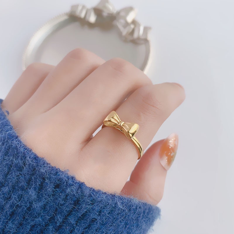 Nhẫn Thép Titan Hình Nơ Màu Vàng 18k Thiết Kế Đơn Giản Dễ Thương Cho Nữ