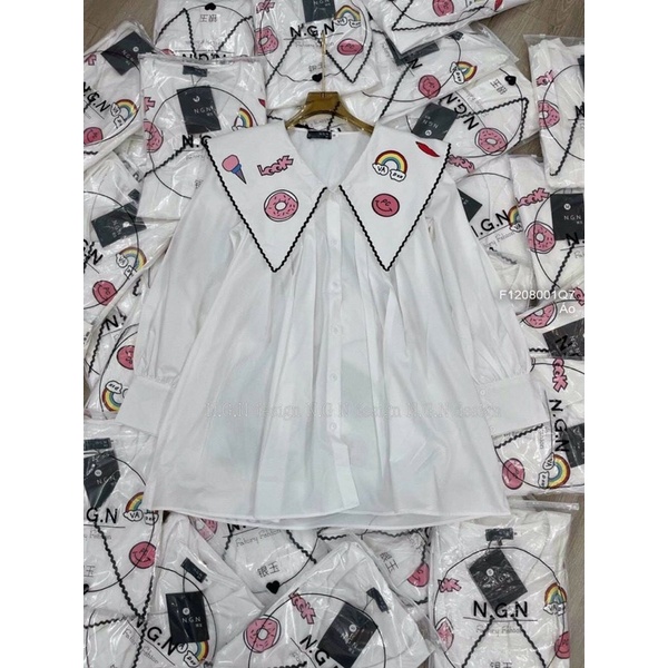 Áo sơ mi Baby cổ nhọn viền thêu phối hình bánh form rộng CƯNG TT1208