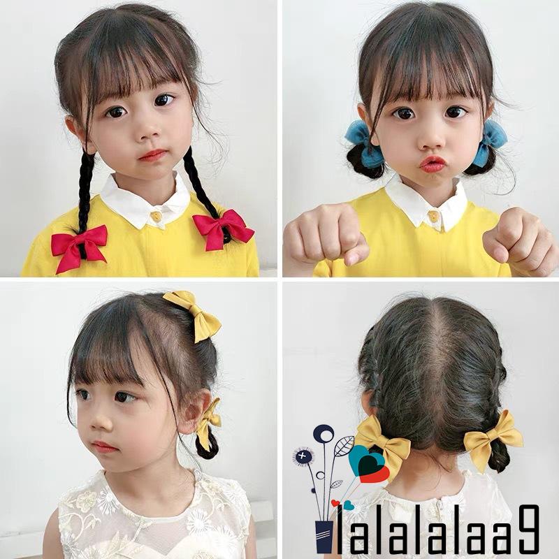 Kẹp tóc hình chiếc nơ vải màu trơn xinh xắn phong cách công chúa cho bé gái