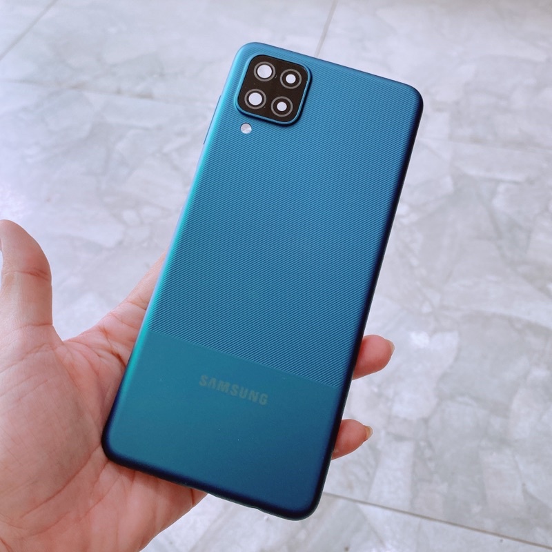 Nắp lưng Samsung A12 kèm cụm kính camera và nút bấm volume , keo dán t8000