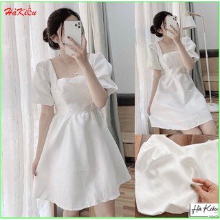 Đầm trắng cổ vuông tay phồng dự tiệc.