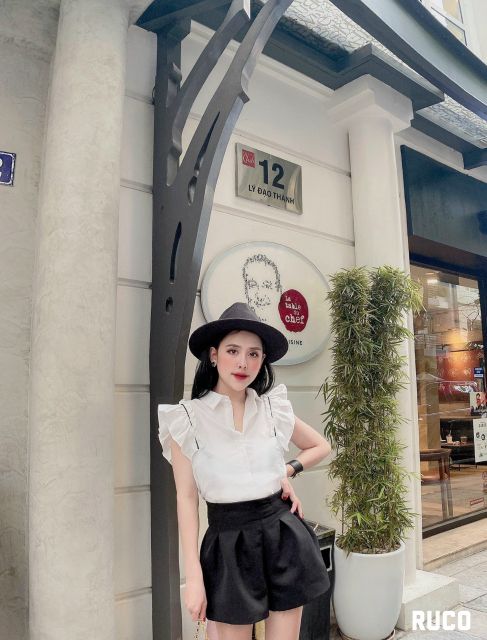 Sơ mi trắng cánh tiên chạy viền đen