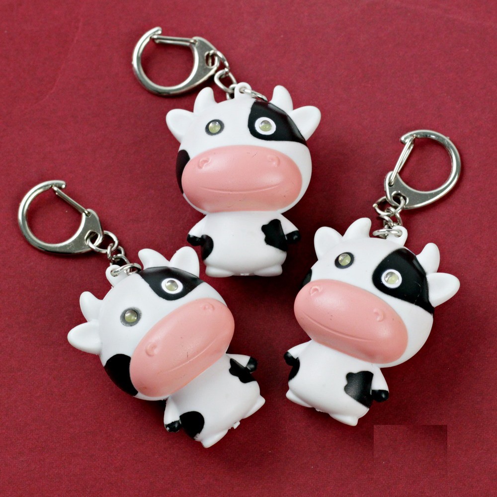 Móc khóa bò sữa mặt ngố có nhạc đèn siêu cute