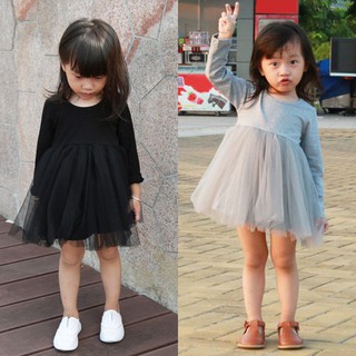 Đầm xoè tay dài cổ tròn màu trơn mềm mại cho bé