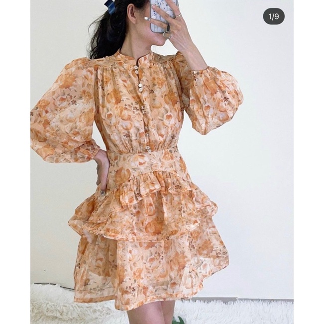 Đầm hoa cam tay dài xòe tầng bèo gài nút đôi