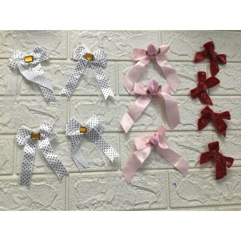 Nơ hoa đuôi dài  dùng để trang trí đính áo , váy , túi xách …