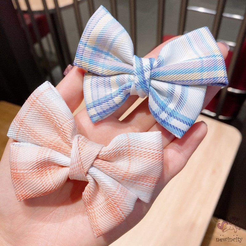 Kẹp tóc đính nơ kẻ sọc ca rô xinh xắn dành cho bé gái