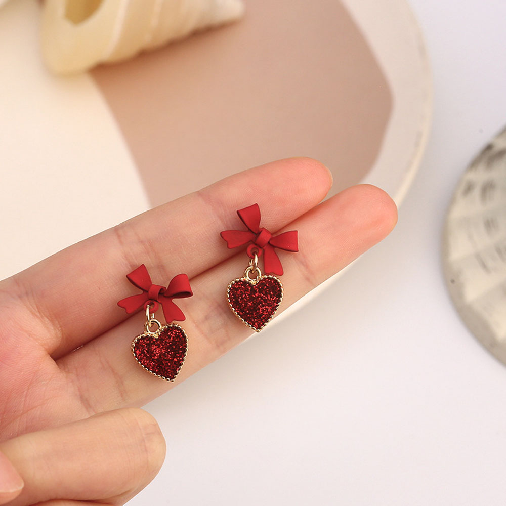 Bông tai hình trái tim đỏ đính nơ nhỏ dễ thương