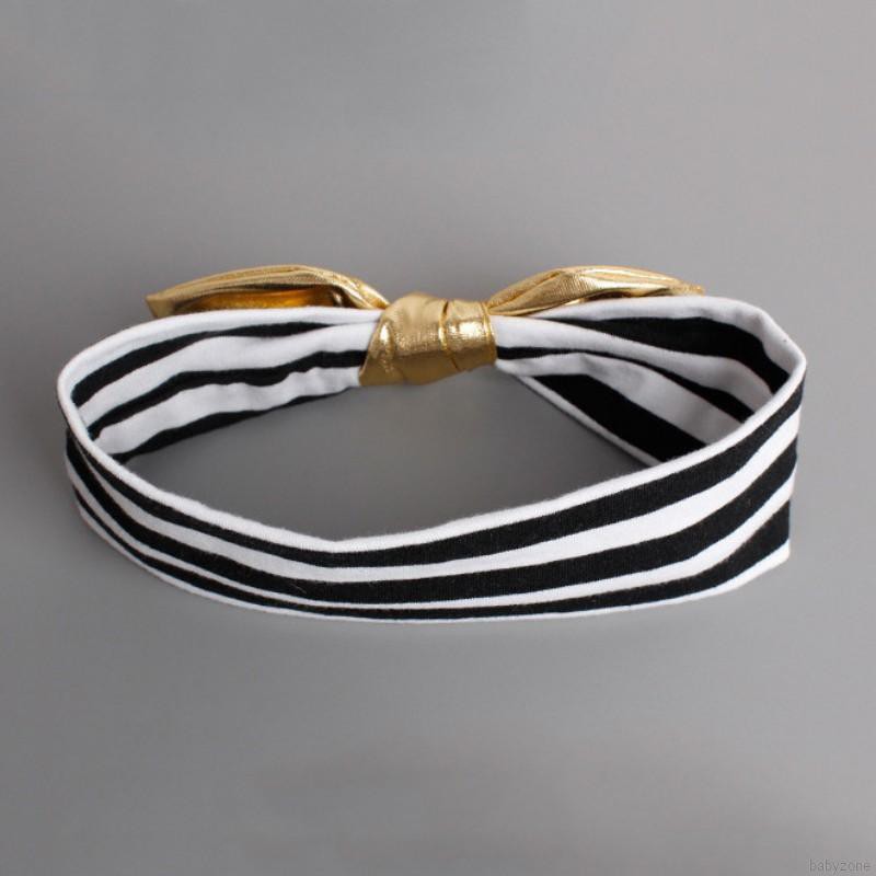 Băng đô vàng đính nơ xinh xắn cho bé gái