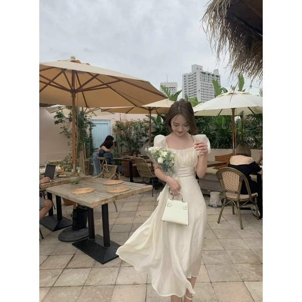 Đầm Midi Kem Xếp Ly Nhún Ngực Tay Bồng Thắt Nơ Lưng