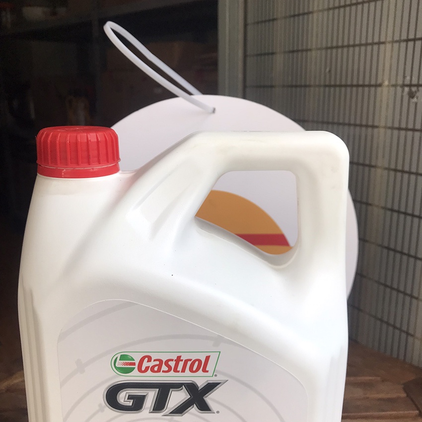 Nhớt Castrol 15W40 chính hãng: dầu nhớt ô tô máy xăng và động cơ diesel GTX SN/CF can 4L