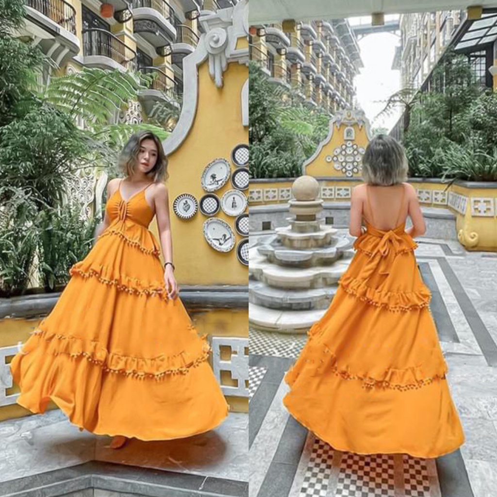 Đầm maxi vàng hở lưng thắt nơ họa tiết tua rua phong cách XUKA DRESS