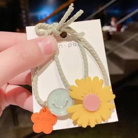 Dây thun buộc tóc đính hoa hướng dương nhỏ cho bé gái