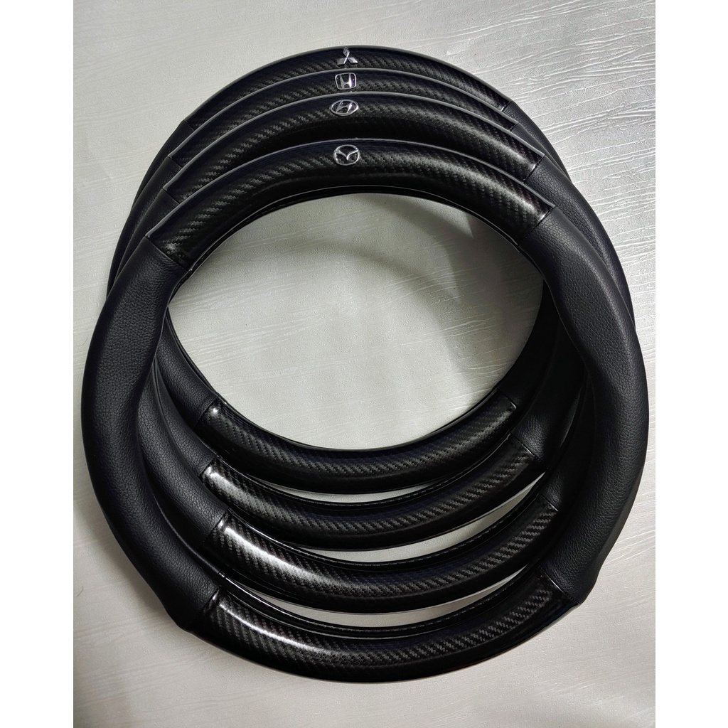 Bọc vô lăng MAZDA 2 Mazda 3 Mazda 6 CX5 BT50 CX8 CX30 chất liệu da vân cacbon đục lỗ thoáng khí