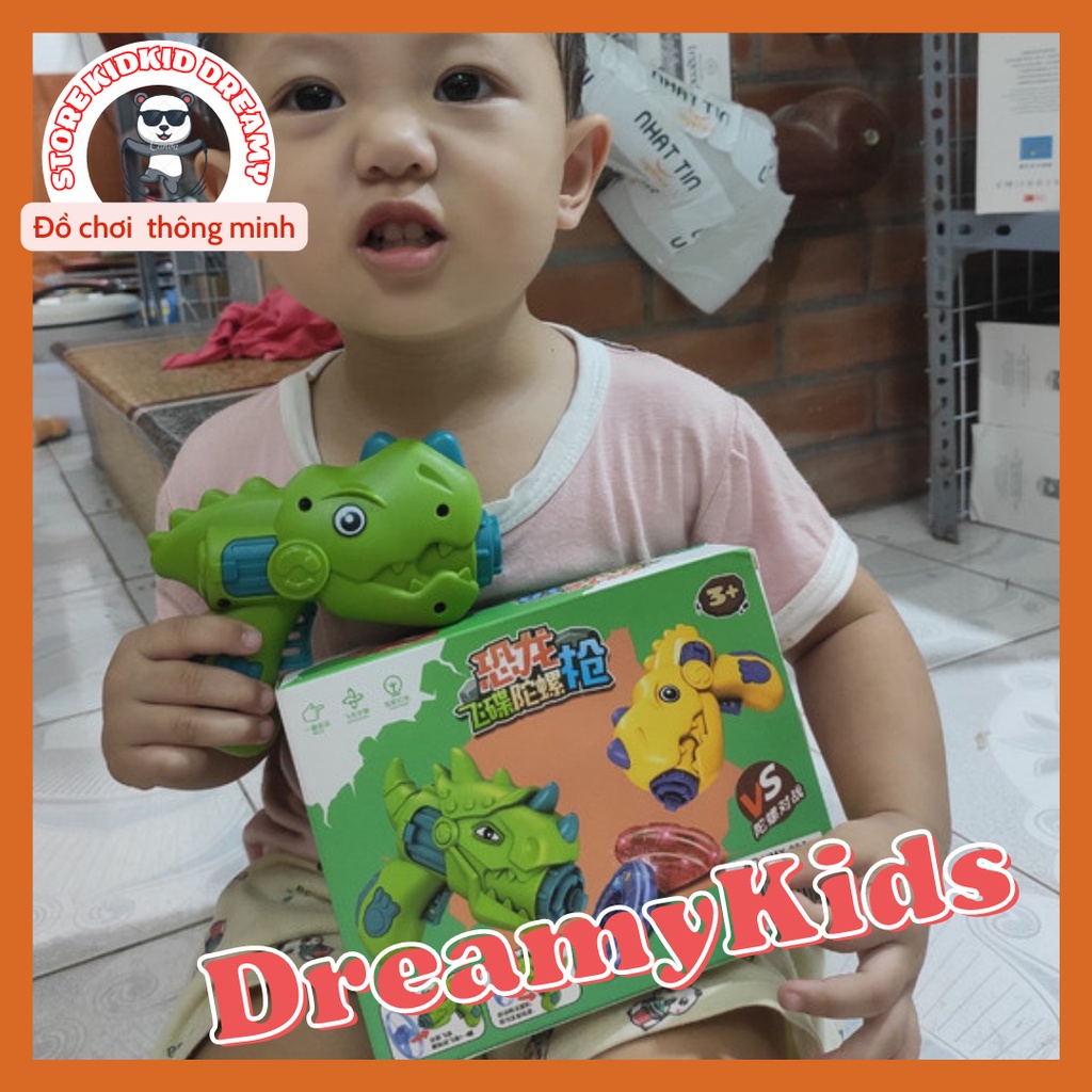 Đồ chơi máy bắn chong chóng, sung bắn con quay khủng long phát sáng chơi cực dễ, mua là mê.